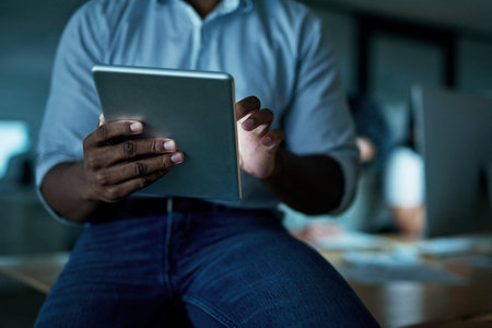 Smart apps keep things streamlined and efficient. an unrecognisable businessman using a digital...