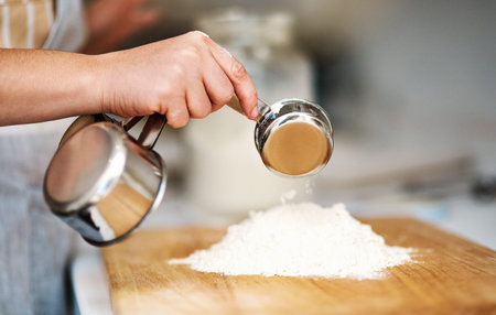 Go ahead and bake. an unrecognizable woman baking in her kitchen.