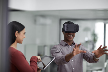 Our customers are going to love this game. two young colleagues using a digital tablet and a virtual...