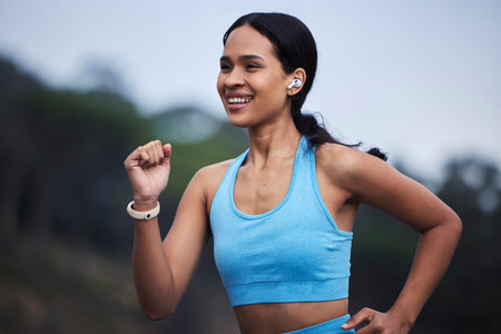 Runner fitness, woman and nature fog in cardio challenge, morning exercise goals and fast energy for...