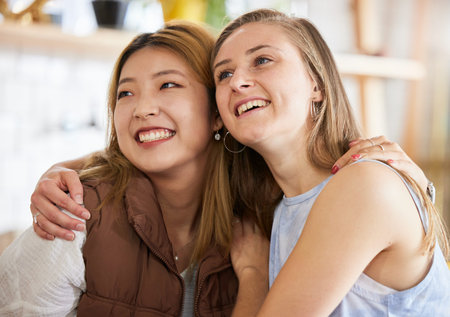 Smile, friendship and women hugging in cafe, happy, love and weekend fun for asian woman and friend....