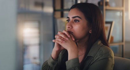 Business woman, thinking and computer at night in office with anxiety, stress or crisis. Female...