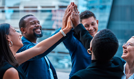 High five, collaboration and motivation with a business team on a balcony together for success or celebration. Teamwork, meeting and wow with a group of corporate people in support of company growthの写真素材