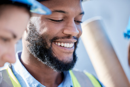 Black man, architect and smile in construction for project planning, teamwork or leadership on site. Happy African American male contractor, engineer or builder smiling for industrial architectureの写真素材