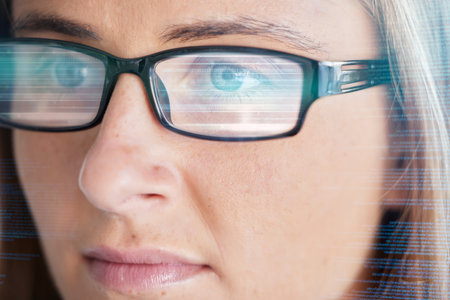 Face, vision and glasses with code, woman in business and programming, data analysis and information technology. Digital overlay, serious female and focus, coding and software development reflectionの写真素材