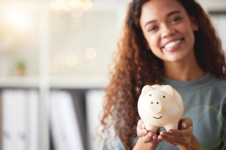 Piggy bank, savings and closeup of a woman with cash for future investment, budget or wealth. Investing, accounting and female person with coins in a money box for profit growth or financial freedom.の写真素材