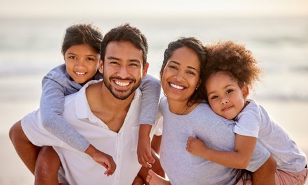 Vacation, beach and portrait of parents with children excited for holiday together at the sea or ocean in summer. Love, father and mother smile with kids relax, care and travel for an adventureの写真素材