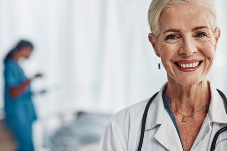 Healthcare, smile and portrait of senior woman doctor in hospital with confidence and success in medical work. Health, medicine and face of confident mature professional with stethoscope and mockup.の写真素材