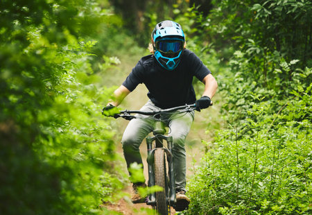 Mountain bike, man and cycling in forest for competition, freedom and off road adventure on path....