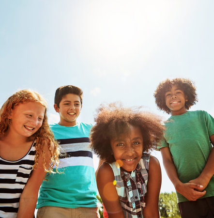 Enjoying the first days of summer with friends. Portrait of a group of diverse and happy kids...