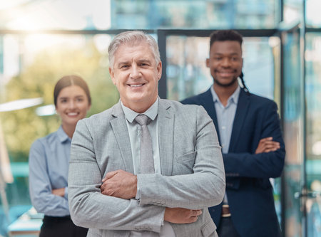 Leadership, team and portrait of business people with arms crossed, pride and unity at a company. Expert, solidarity and manager with employees, confidence and support at a corporate agencyの写真素材