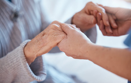 Elderly woman hands, support and holding healthcare worker for medical care or help walking....