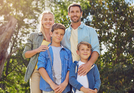 Were a forest-loving family. Cropped portrait of a family of four walking in the woods.