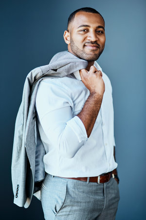Youve got to look the part of a successful man. Studio portrait of a young businessman standing...