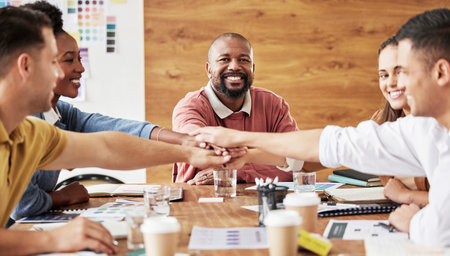 Hands together, business people and portrait of meeting success and company collaboration. Conference room, happiness and smile of corporate administrator team with diversity support and teamworkの写真素材