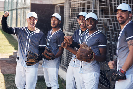Passion like their makes you want to play with. a group of young baseball players celebrating after watching a game.の写真素材