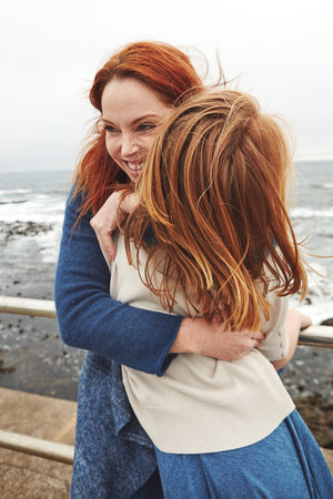The greatest gift you can give your child is time. a mature woman and her young daughter at the waterfront.の写真素材