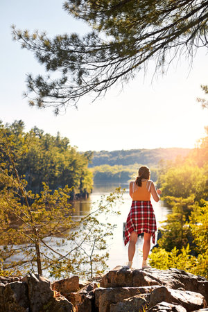 Take in the beauty of the real world. a young woman out hiking.の写真素材