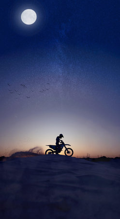 Motorcycle, sport and silhouette riding against night, sky and background in nature, extreme sports...