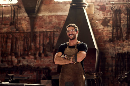 I was born to weld. Portrait of a handsome young metal worker working inside a welding workshop.