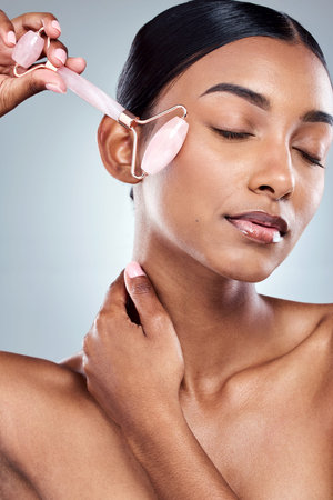 Better than a trip to the day spa. an attractive young woman posing in studio against a grey background.の写真素材
