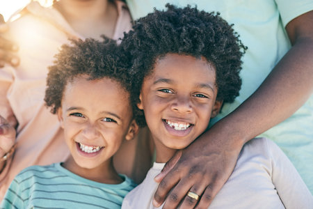 Portrait, children and boys siblings with parents smile, happy and excited for vacation or holiday with family outdoors. Kids, faces and African American young people joyful and relax on a tripの写真素材