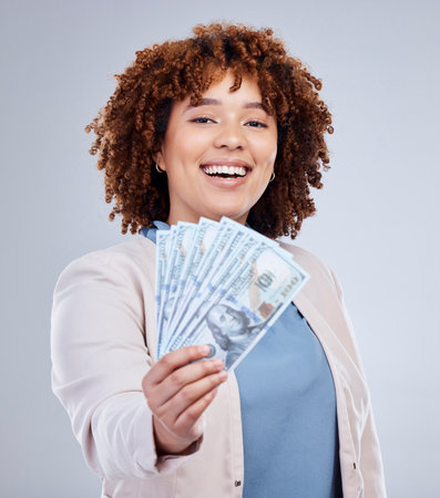 Fan, cash and woman portrait isolated on a white background for winning, cash success or happy finance. Rich, wealth and face of african person or winner bonus, cashback and financial loan in studioの写真素材