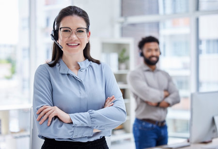 Crossed arms, customer support and portrait of woman in call center, helping and coworking office. Professional, telemarketing and female worker with headset for contact, crm service and consultingの写真素材