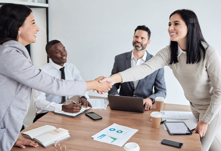 Meeting, welcome and business women shaking hands in the boardroom for a b2b partnership or deal....