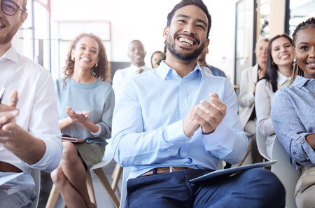Business people, laughing and audience applause at a conference, seminar or corporate workshop. Professional men and women group together in crowd for convention, training and presentation successの写真素材