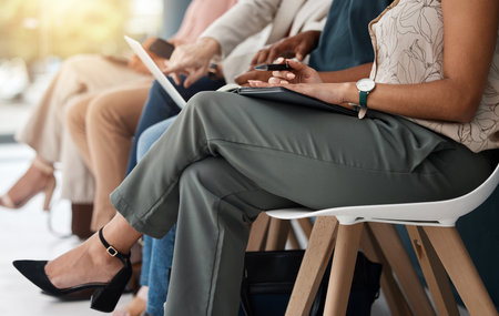 Hiring, row and legs of business people for job interview, vacancy and career opportunity in office. Corporate, diversity and men and women candidates for hr meeting, recruitment and employmentの写真素材
