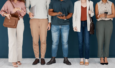Hiring, technology and business people in row for job interview, vacancy and career opportunity in office. Corporate, diversity and men and women candidates for hr meeting, recruitment and employmentの写真素材