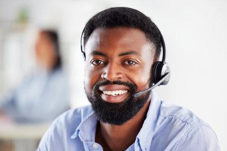 Black man, call center portrait and smile in office for communication, tech support job or microphone. African guy, telemarketing and happy for sales consulting, customer service or help desk for crmの写真素材