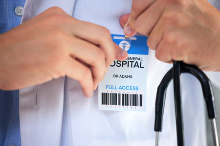 Hospital ID, doctor hands and clinic access pass of general health practitioner with stethoscope. Icu card, nurse and medical worker ready for working and healthcare help with a wellness cardの写真素材