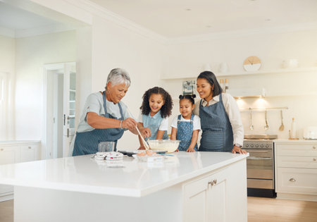 Grandmother, mom or children baking as a happy family with girl siblings learning cookies recipe at...