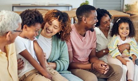 Family, generations and love with happiness and support at home, grandparents and parents with kids. Relax in living room, happy people together with unity and bonding, care with diversity and trustの写真素材