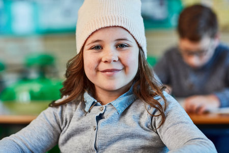 Happy to be in class. an elementary school girl in the classroom.の写真素材