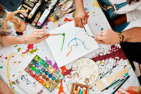 Art has no method. High angle shot of an unrecognizable group of artists sitting together and painting during an art class in the studio.の写真素材