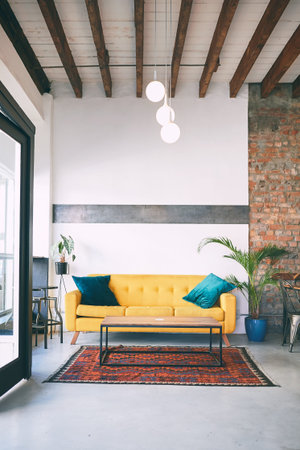 Youll feel right at home in our cafe. a sofa in an empty cafe.