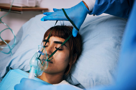 Recovery, patient and woman in bed, oxygen and healthcare problem with breathing issue, anesthesia and sick. Female person, lady and model with medical equipment, disease and illness in clinicの写真素材