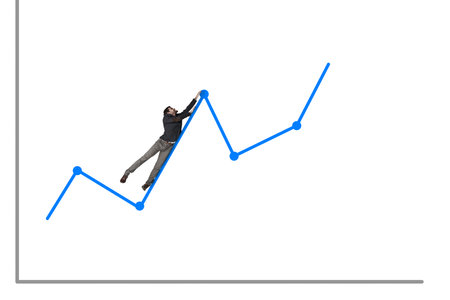 A risky investment can turn into one big rollercoaster ride. a businessman hanging onto a rising graph against a white background.の写真素材