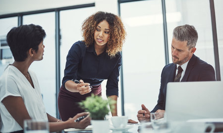 Thats not up for discussion right now. a group of businesspeople having a meeting in the boardroom.の写真素材