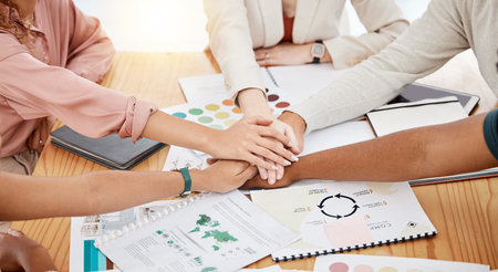Hands stacked, business and creative people for brand development, project goals and teamwork on...