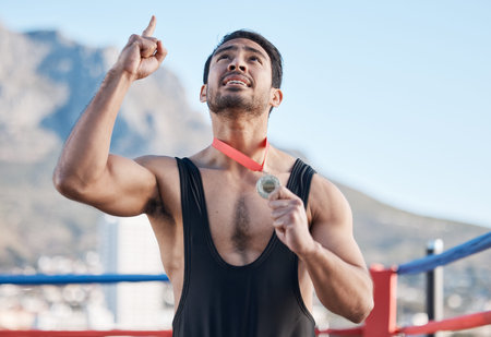 Winning, boxing medal and a man with thanks to God, celebration and sports gratitude. Success, young...