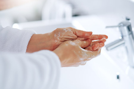 Your hands should always be clean. an unrecognizable woman washing her hands.の写真素材
