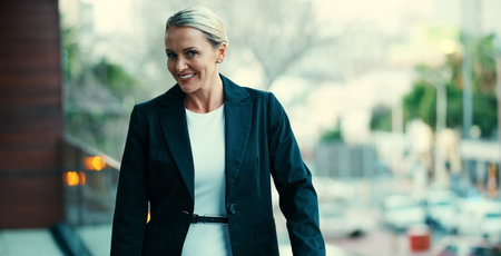 Im here for the business. Portrait of a mature businesswoman standing outside on the balcony of her...