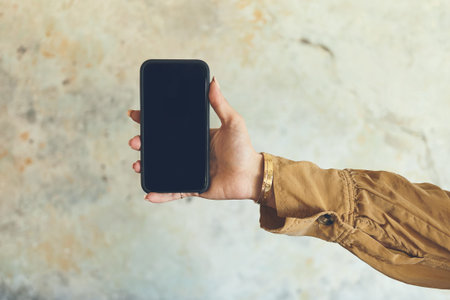 Everyone will soon know about this news. Closeup shot of an unrecognisable woman holding a cellphone...