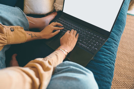For every question, the internet has an answer. an unrecognisable woman using a laptop on the sofa...