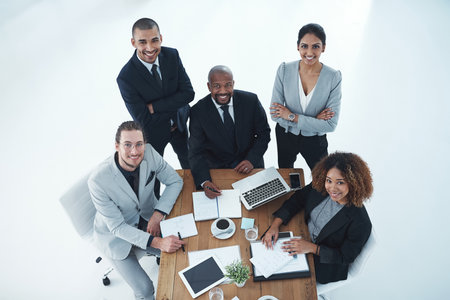 In the pursuit of goals. High angle shot of a group of businesspeople having a meeting.の写真素材