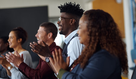 Ending the presentation in high spirits. a group of businesspeople applauding during a presentation...